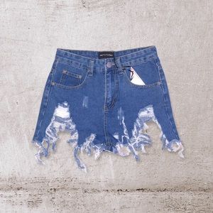 Pretty little thing extreme ripped denim shorts